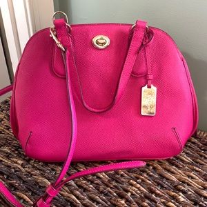 Pink coach crossbody purse with multiple pockets shoulder strap or handles